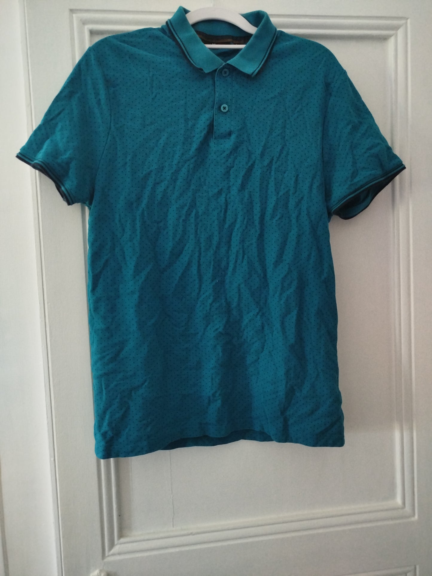 Polo bleu motif points noirs. Taille L