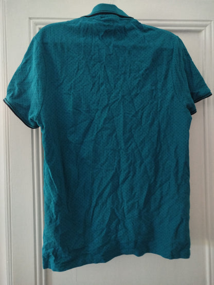 Polo bleu motif points noirs. Taille L