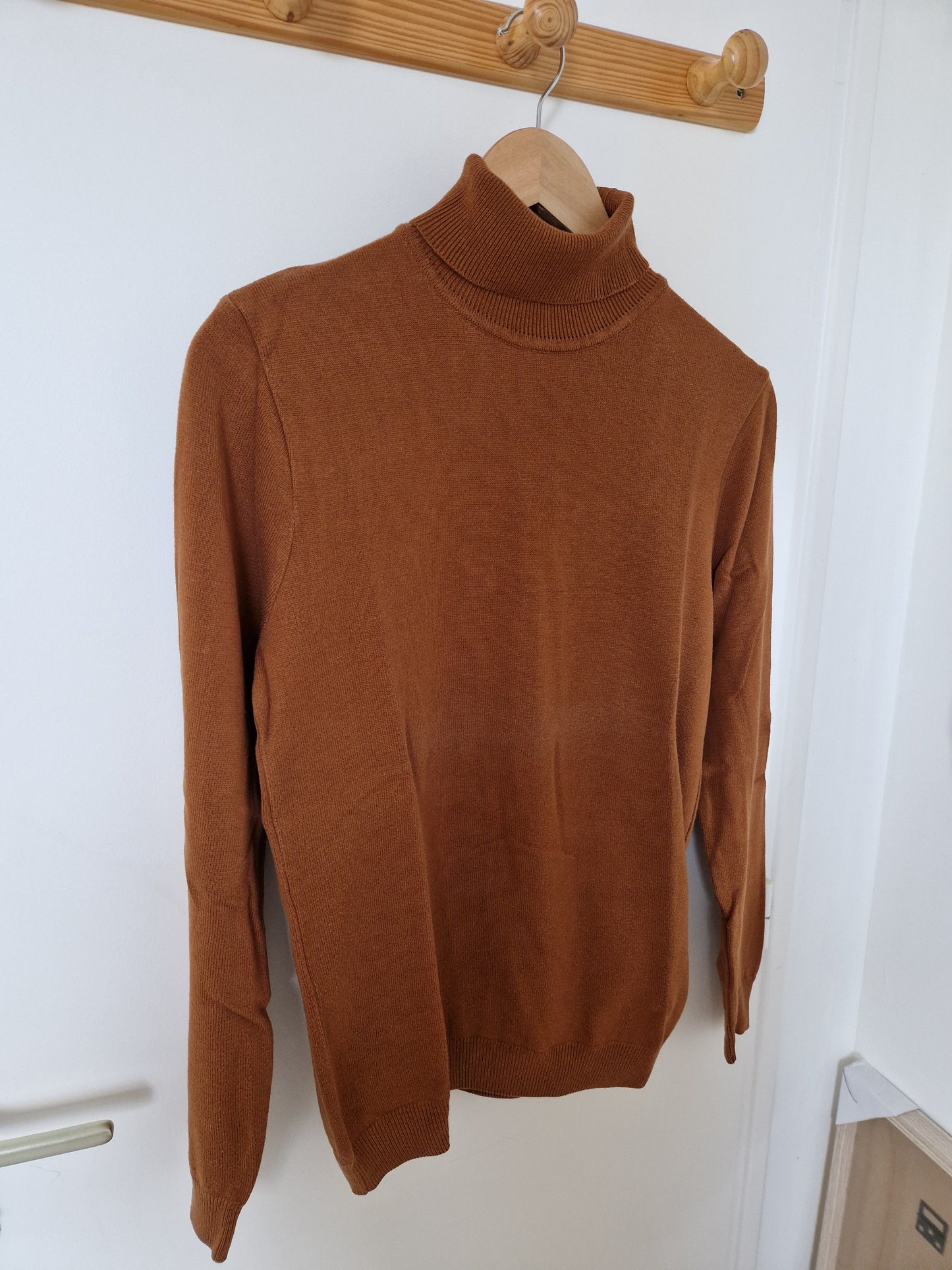 Pull col roulé uni