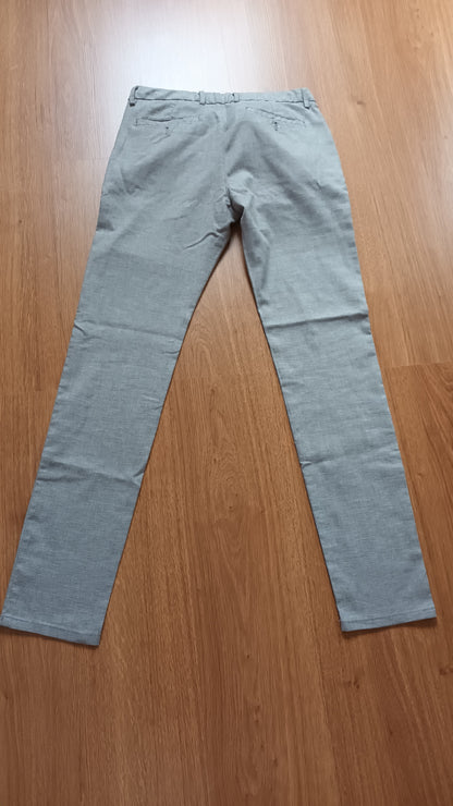 Pantalon slim fantaisie pied de puce
