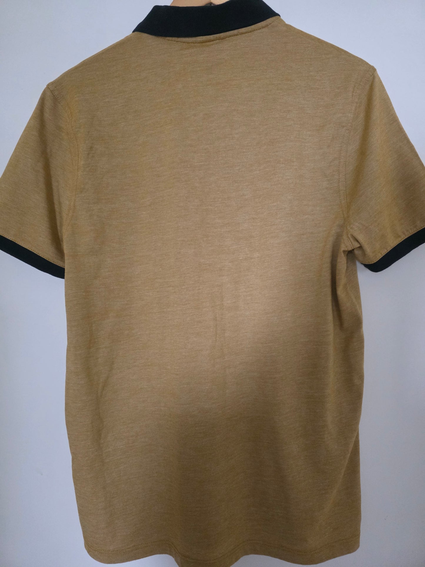 Polo micro rayé avec poche