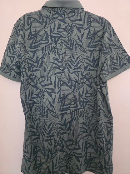Polo vert motif feuilles