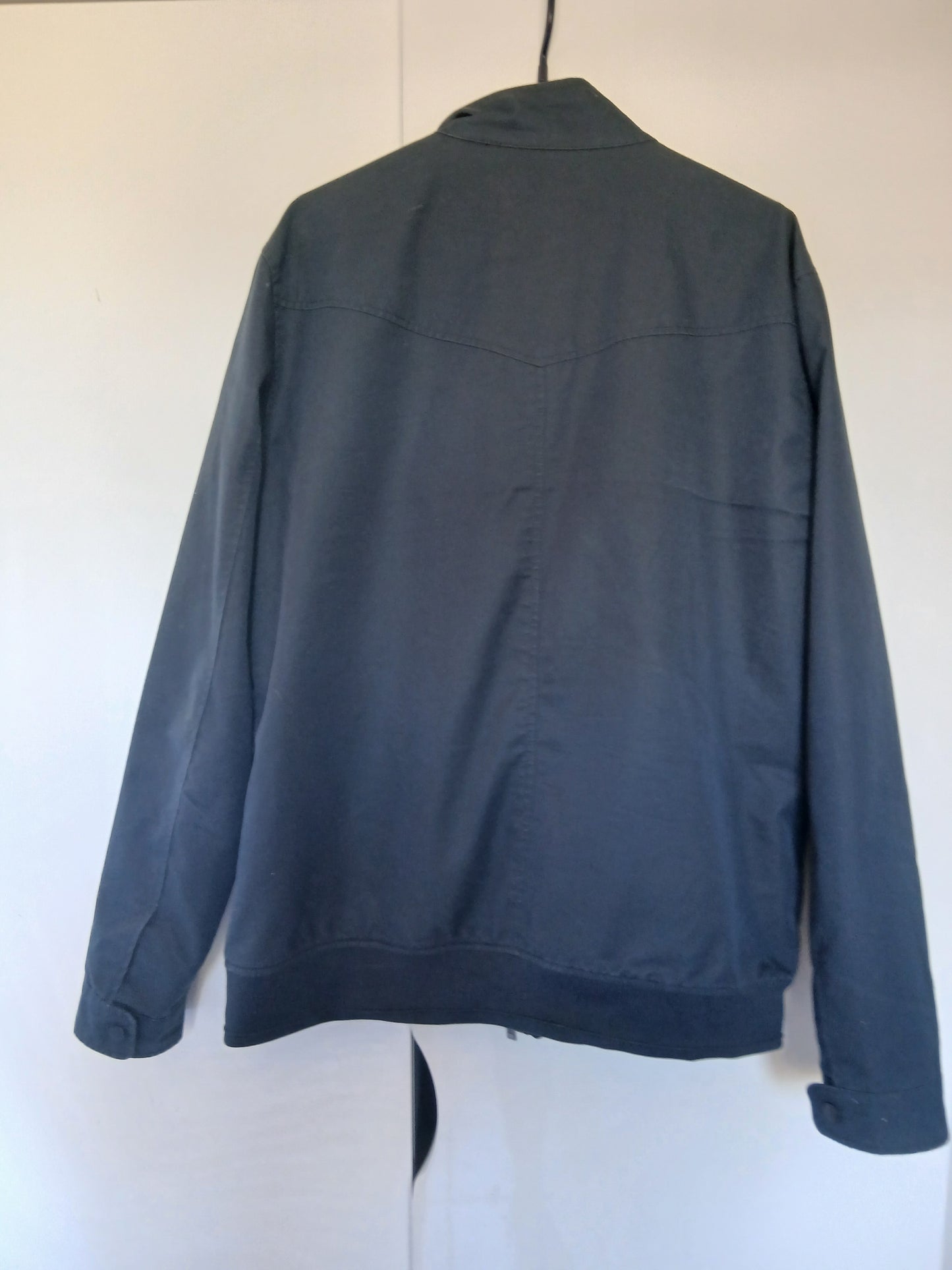 Blouson col montant doublure fantaisie.