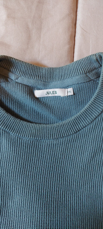 Pull col rond à poche contrastée