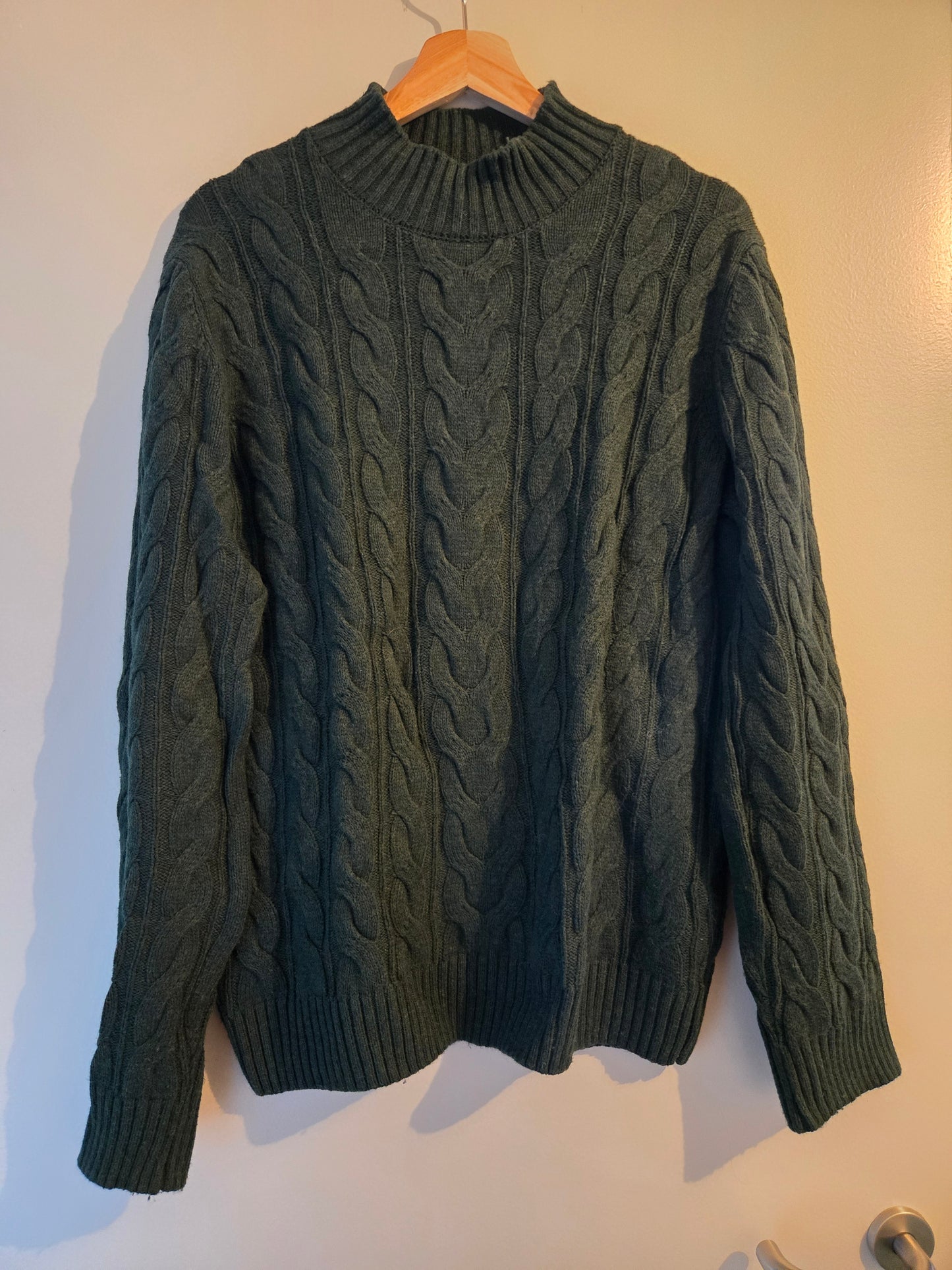 Pull col montant laineux à torsades