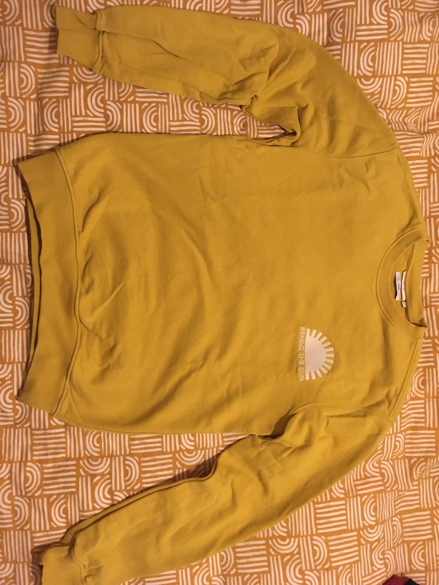 Sweat col rond broderie soleil poitrine