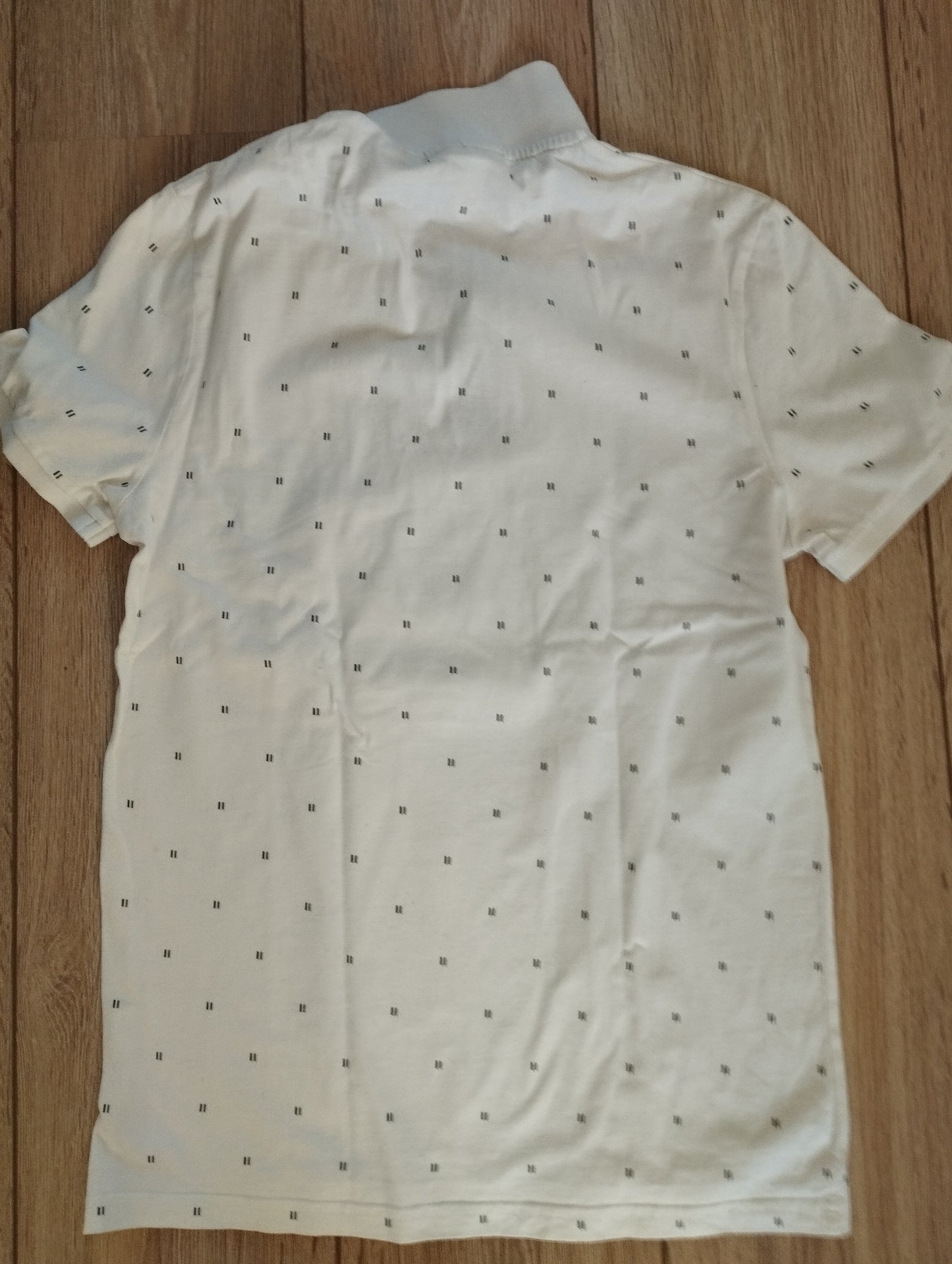 Polo blanc/écru à motifs