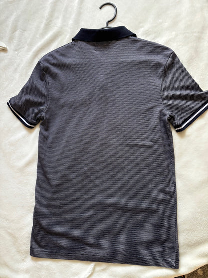 Polo matière fantaisie et poche fantaisie